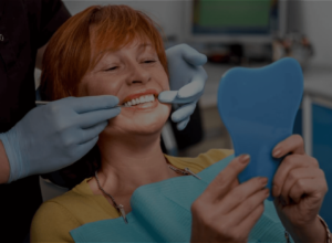 dentist hands in patient's mouth